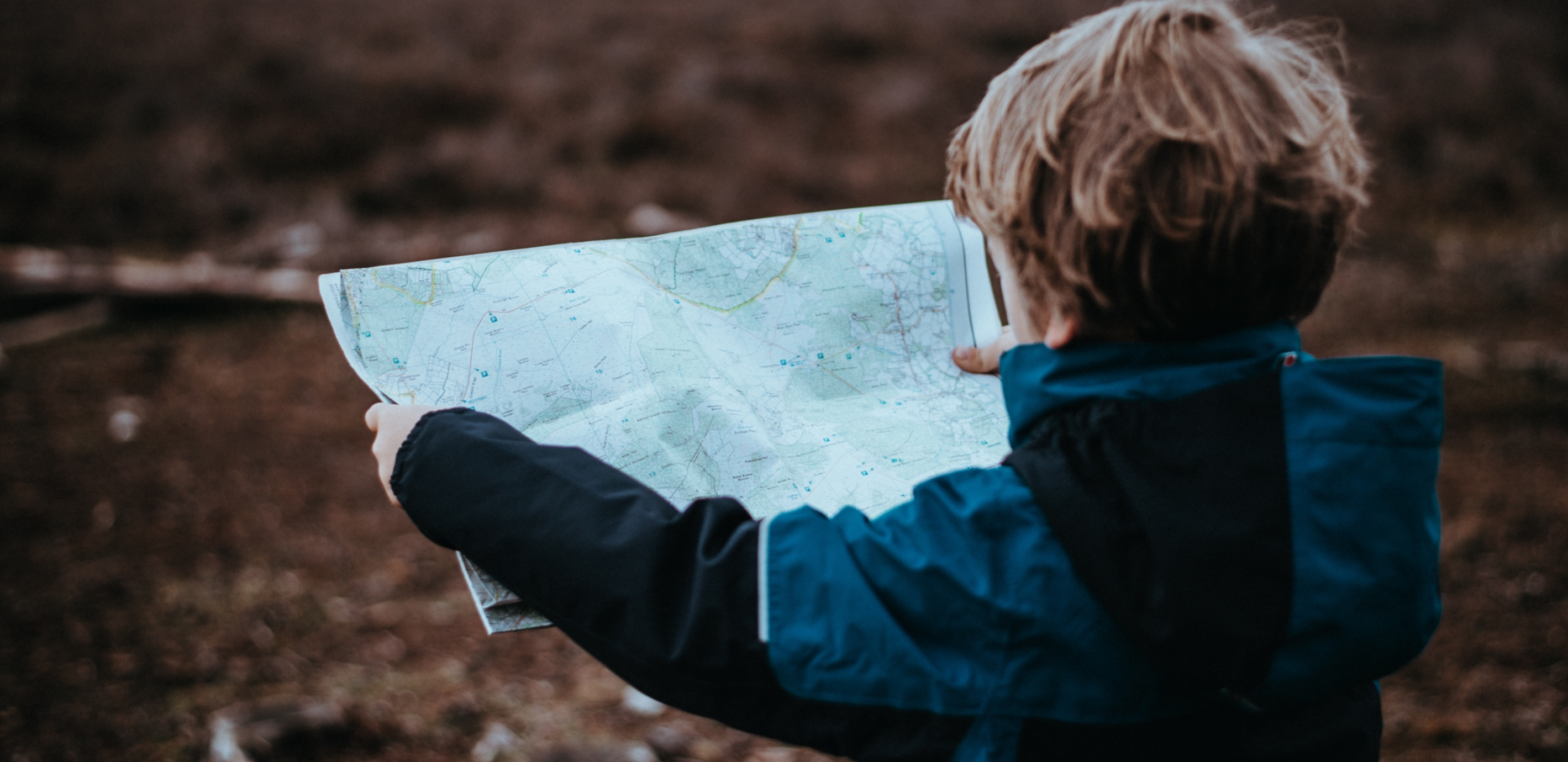 Child looking at a map