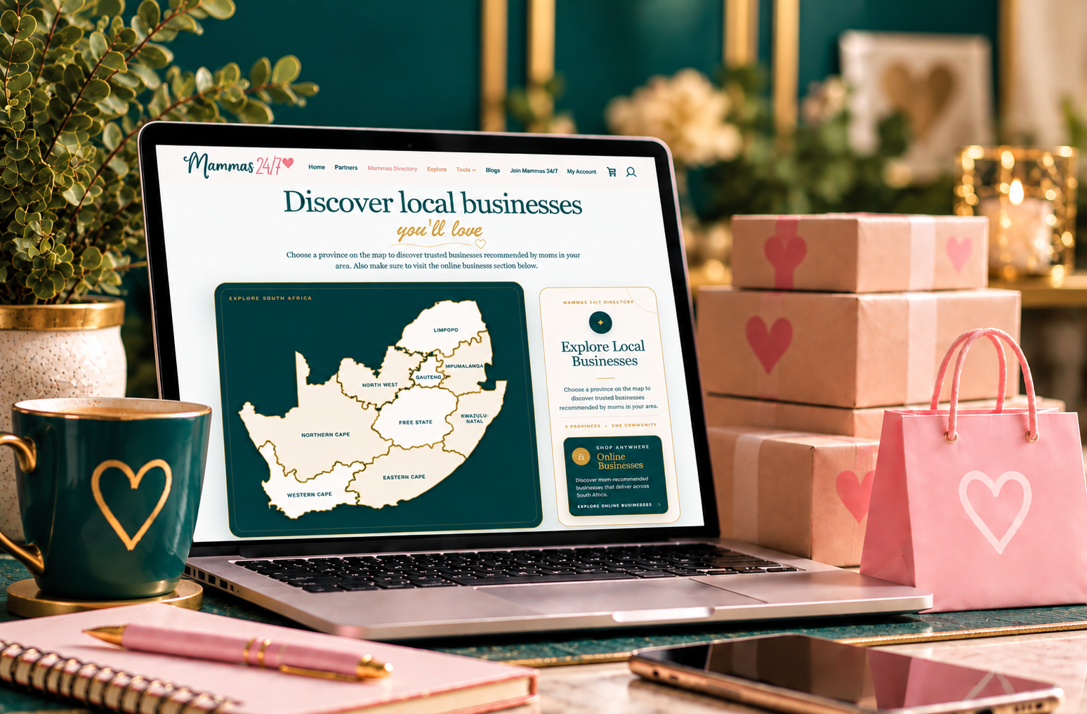 Mammas Directory website displayed on a laptop, surrounded by parcels and shopping accessories.
